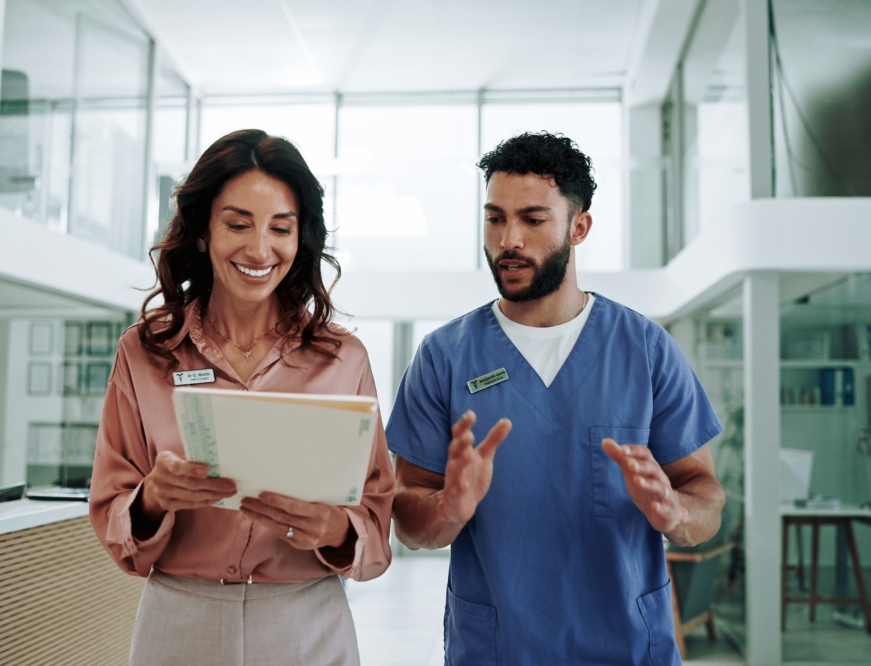 Medical team collaborating in hospital hallway