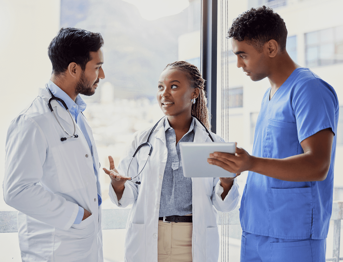 Medical team collaborating with tablet