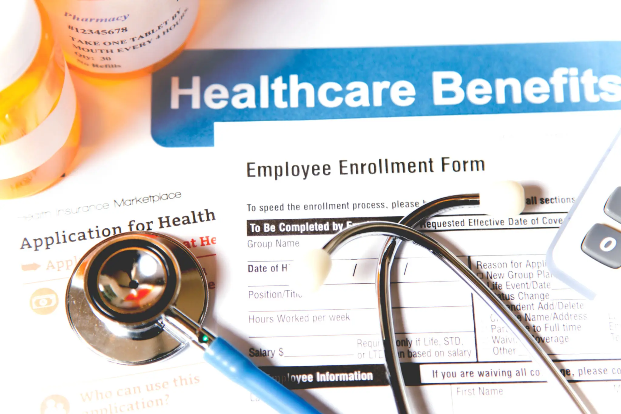 Stethoscope on employee healthcare enrollment form