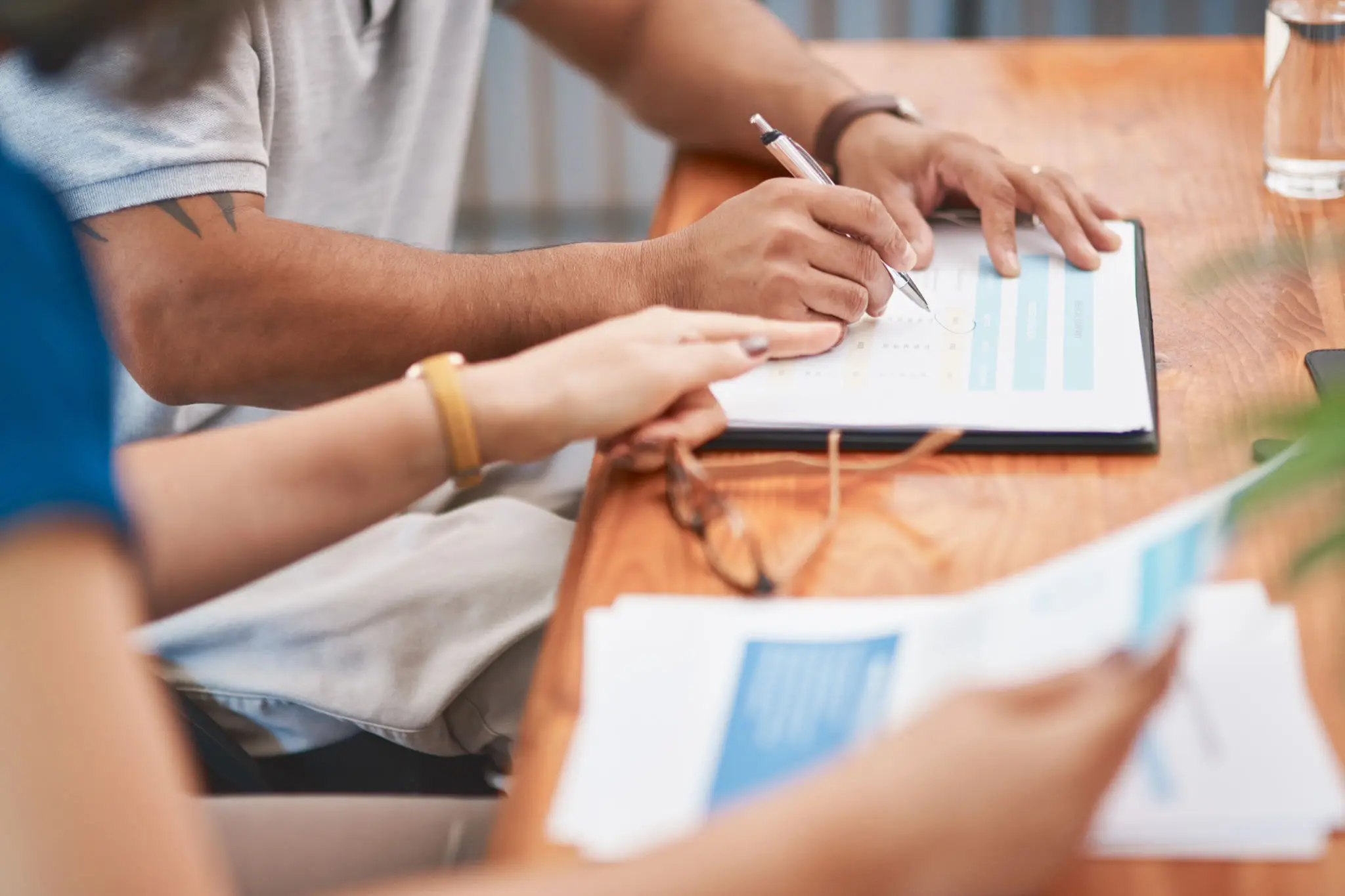 People reviewing business charts and documents